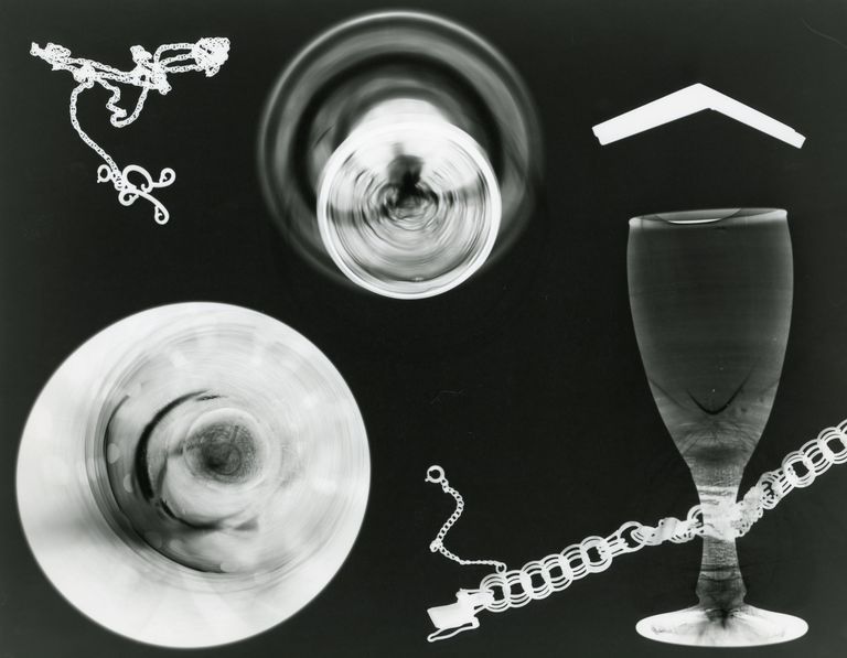 Creative abstract art featuring x-ray imagery of glass objects and chains.